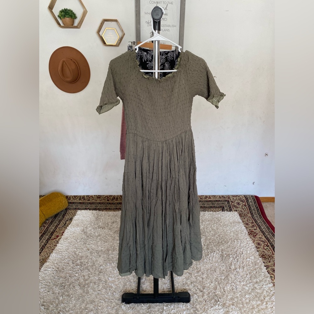 Smocked midi dress in olive green with small Pom Pom details